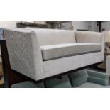 SOFA, ivory velvet upholstered, with patterned fabric accent to exterior, 180cm x 94cm x 78cm.
