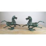 CHINESE ARCHAIC STYLE, 'Flying Horses', a pair bronze with verdigris finish, 65cm L x 45cm H. (2)