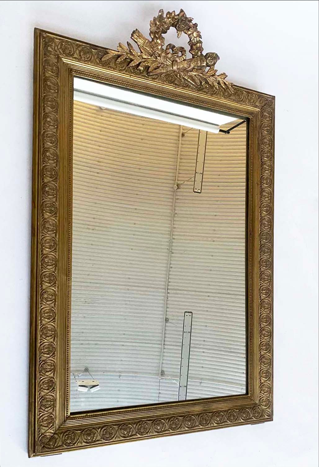 OVERMANTEL MIRROR, late 19th/early 20th century French giltwood and gesso moulded with quiver and