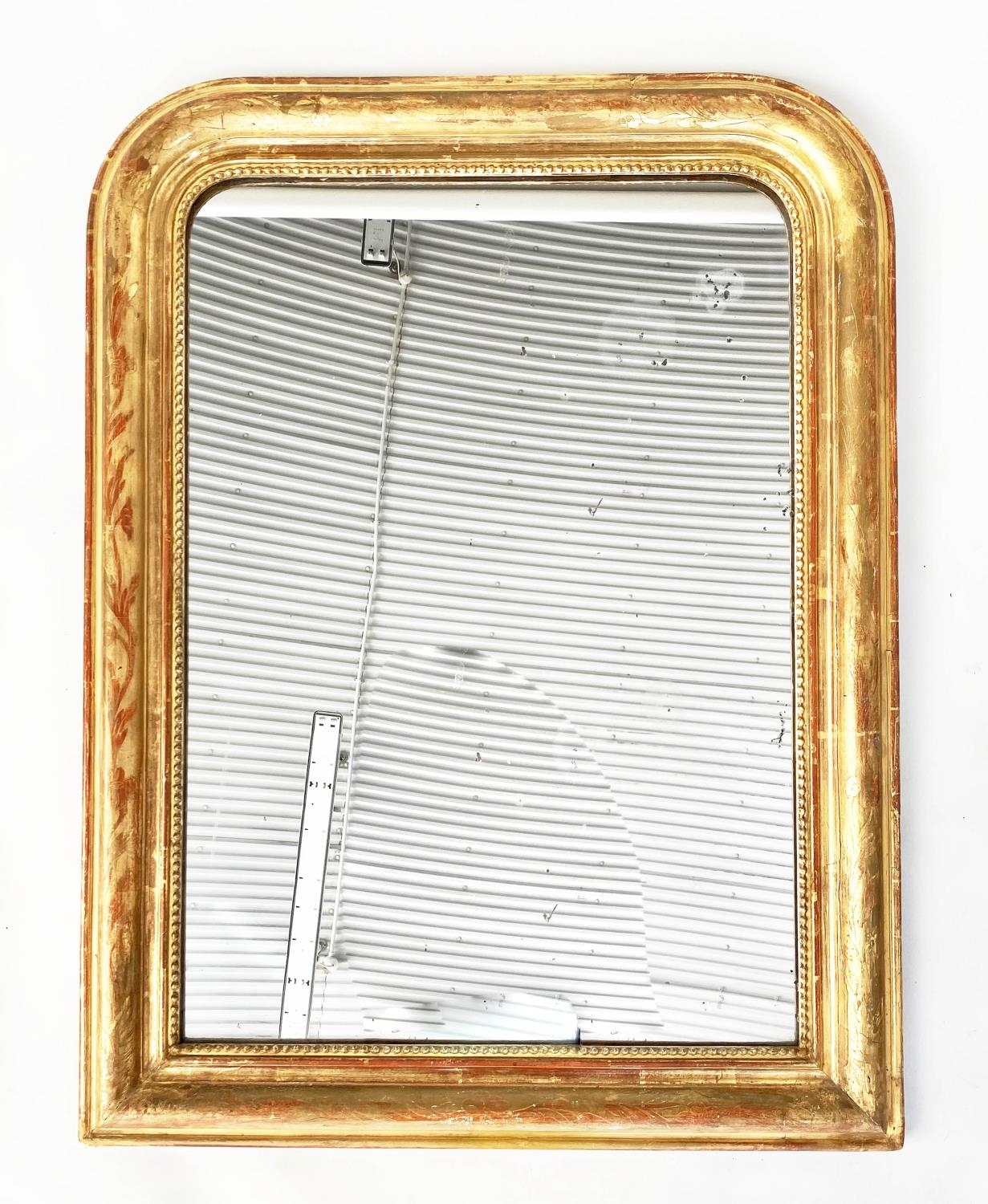 OVERMANTEL MIRROR, 19th century French giltwood and gesso moulded with arched incised and beaded