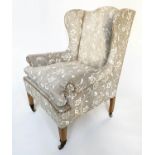 WING ARMCHAIR, Edwardian cream/parchment two tone foliate upholstered on square tapering supports,