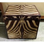 ZEBRA SKIN TRUNK, square form brown leather with brass studs and carrying handles, 63cm H x 67cm x
