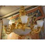 CHANDELIER, 90cm W x 90cm H excluding chain, gilt metal and frosted glass with nine lights and six