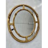 WALL MIRROR, 19th century French giltwood and gesso moulded with oval and marginal bevelled mirror