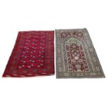 PERSIAN RUG, 167cm x 105cm, together with a bokhara rug, 160cm x 115cm. (2)