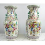 CHINESE FAMILLE ROSE VASES, a pair, with courtyard scenes, 46cm H. (2)