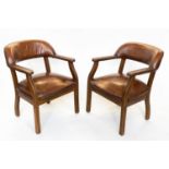LIBRARY ARMCHAIRS, a pair, walnut and studded mid tan leather each with curved back, 62cm W. (2)