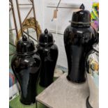 TEMPLE JARS, a set of three glazed ceramic, black finish, 103cm H. (3)