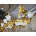 CHANDELIERS, 73cm W x 80cm H excluding chains, a set of three, gilt metal and frosted glass with six