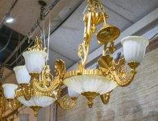 CHANDELIERS, 73cm W x 80cm H excluding chains, a set of three, gilt metal and frosted glass with six