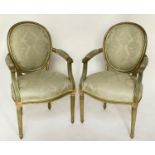 FAUTEUILS, a pair, French Louis XVI style green and parcel gilt with brocade upholstery, 58cm W. (2)