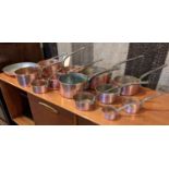 BATTERIE DE CUISINE, comprising of a set of seven graduated pans, the largest 18cm diam, another set