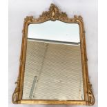 OVERMANTEL MIRROR, 19th century French, giltwood and gesso moulded with C scroll crested arched
