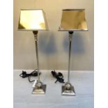 LIBRARY LAMPS, a pair, Maison Jansen style each measuring 64cm high, 18cm wide, polished metal