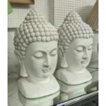 BUDDHA BUSTS, a pair, 49cm H, white painted resin. (2)
