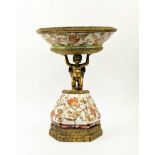 LATE 19TH CENTURY STYLE FIGURAL TAZZA, stamped 1895, hand finished floral foliage decoration to