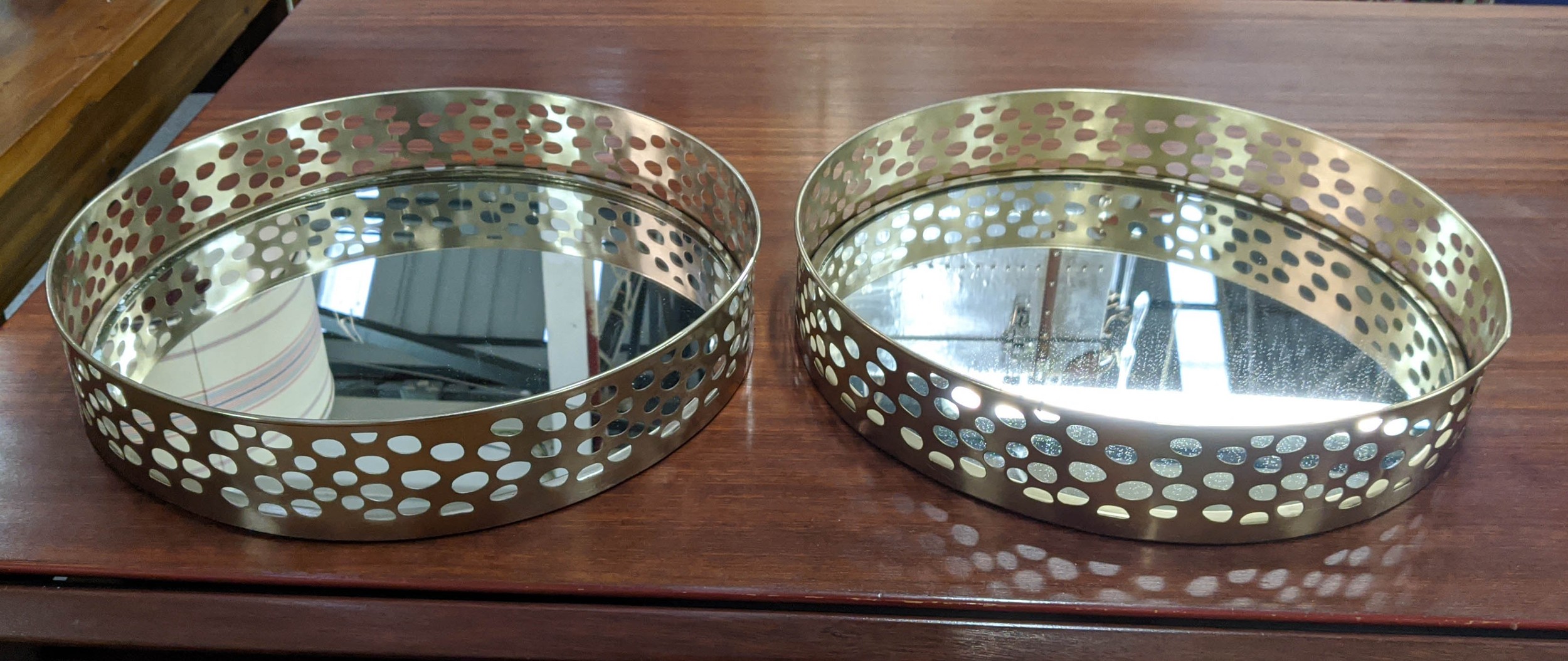 COCKTAIL TRAYS, a pair, 1970s Italian style, gilt finish with mirror 41cm x 41cm x 8cm. (2)