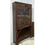 ARTS AND CRAFTS BOOKCASE, early 20th century oak with leaded glazed doors, copper hinges and