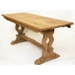 REFECTORY TABLE, early 20th century solid oak, planked rectangular with pierced slab trestle