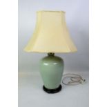 CHINESE LAMP, incised celadon with brass fitting and turned wooden base with silk shade, 50cm H.