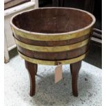 PLANTER, 59cm H x 55cm x 43cm D, circa 1900, oak and brass banded of oval form on later legs.