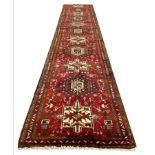 PERSIAN HERIZ RUNNER, 390cm x 77cm.