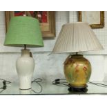 A POOKY TABLE LAMP, with a green linen shade, the base of inverted baluster form, cream body, 70cm