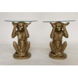 MONKEY MARTINI TABLES, a pair, each with glass top supported by monkey base, 50cm H x 43cm. (2)