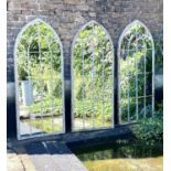 ARCHITECTURAL GARDEN MIRRORS, set of three, 160cm high, 67cm wide, arched metal frames, aged finish.