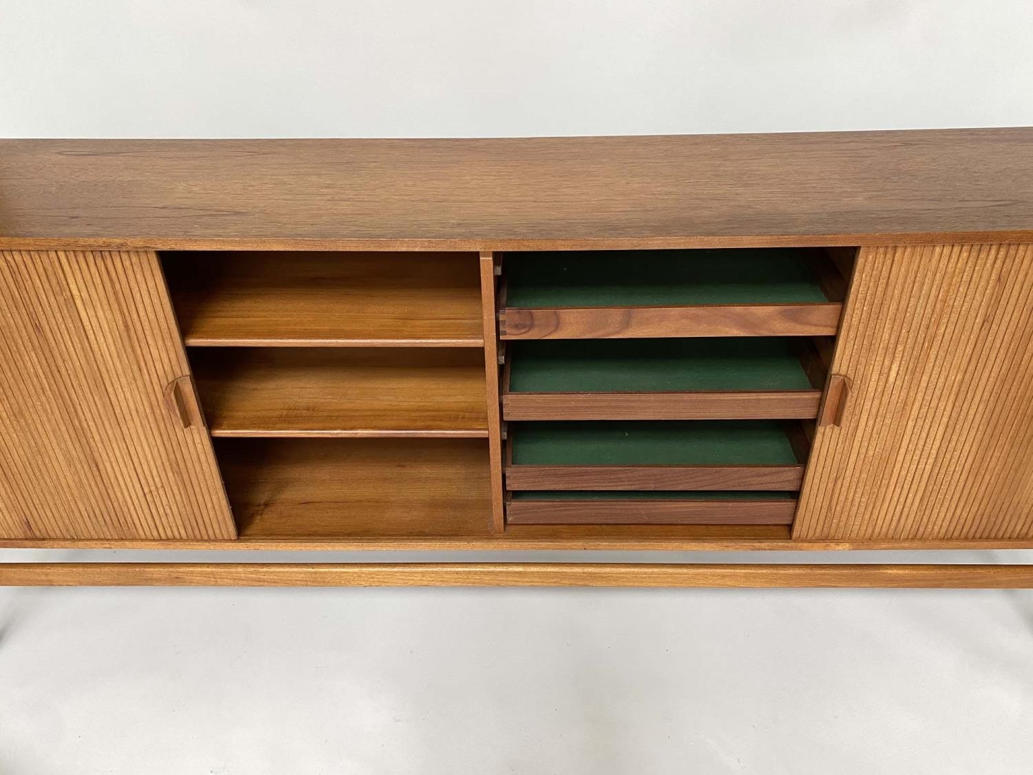 SIDEBOARD, mid 20th century teak, with tambour sliding front enclosing four shelves and four sliding - Image 4 of 5