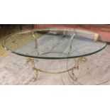 MAISON JANSEN STYLE COCKTAIL TABLE, rams head detail, gilt metal and glass, 126cm x 71cm x 51cm.
