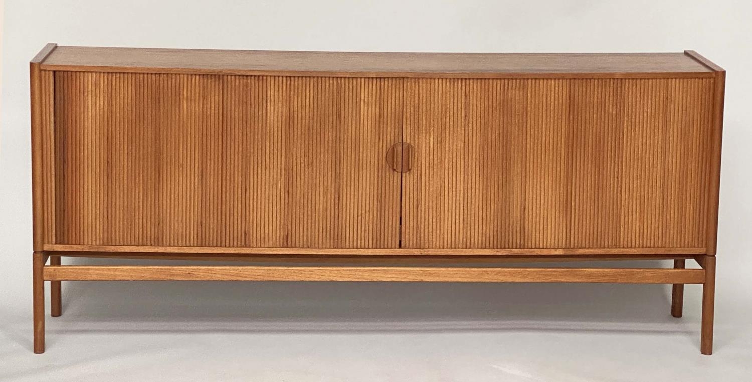 SIDEBOARD, mid 20th century teak, with tambour sliding front enclosing four shelves and four sliding