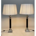 TABLE LAMPS, a pair, black and silvered metal, with stepped bases and pleated shades, 96cm H. (2)