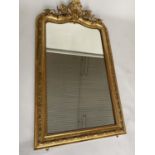 OVERMANTEL MIRROR, 19th century French giltwood and gesso moulded with foliate arched and C scroll