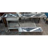 CONSOLE TABLES, a pair, 137cm x 26cm x 80cm, silvered metal, antiqued mirrored tops and