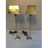 LIBRARY LAMPS, a pair, 59cm high, 1960s French style, polished metal. (2)