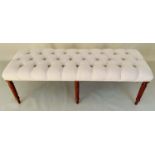 HALL SEAT, 51cm high, 122cm long, 44cm deep, deep buttoned neutral upholstery, raised on turned