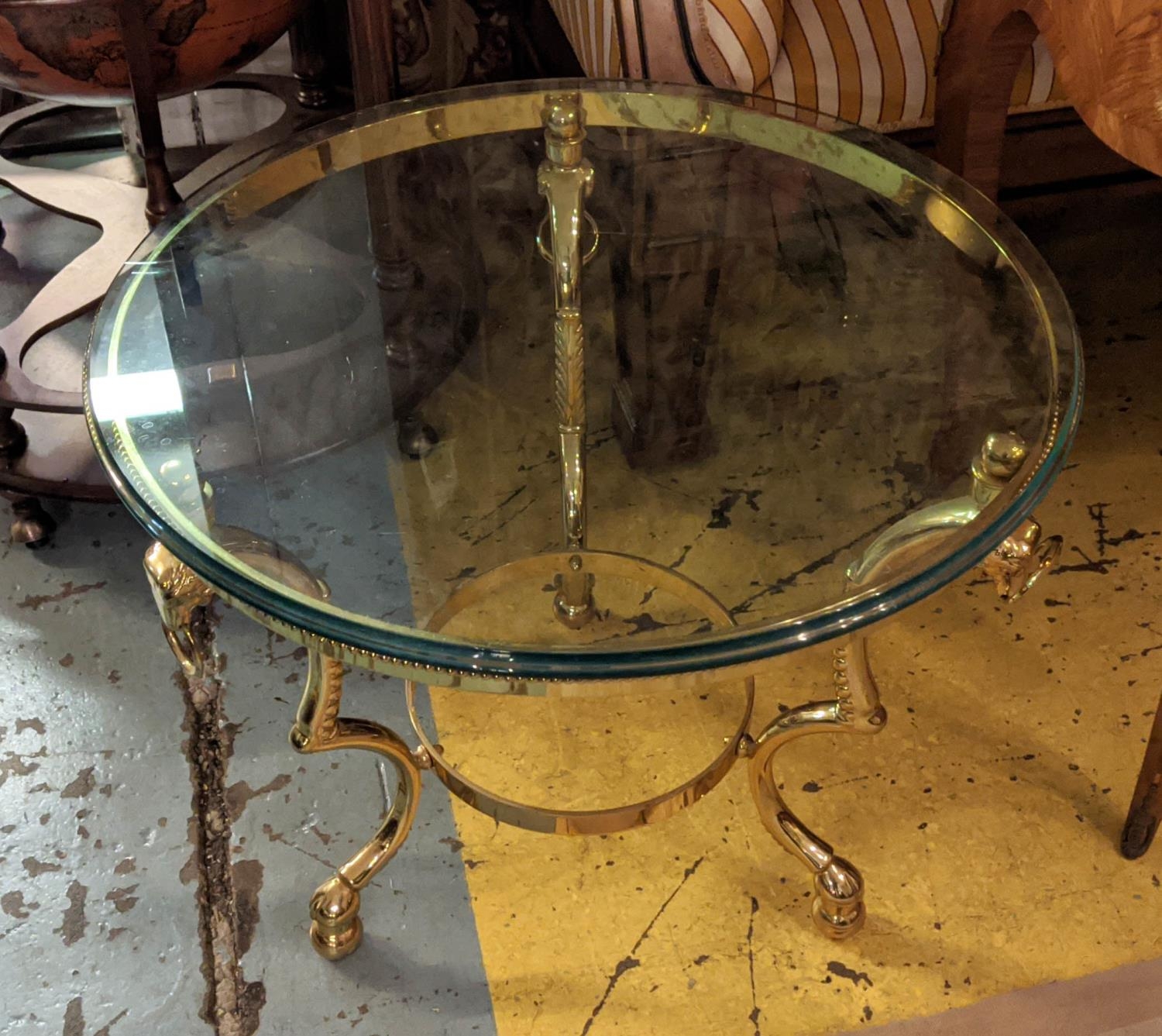 MAISON JANSEN STYLE SIDE TABLE, rams head detail, gilt metal and glass, 65cm x 50cm.