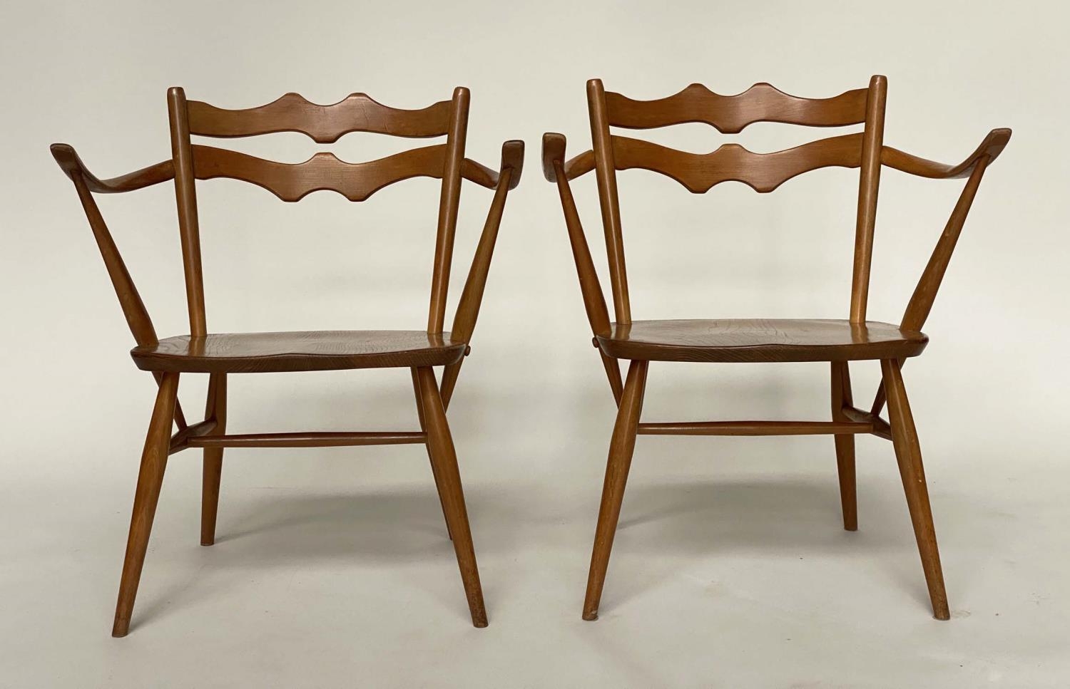 ERCOL EASY ARMCHAIRS, a pair, elm with wave back and outswept arms, 64cm. (2) - Image 3 of 6