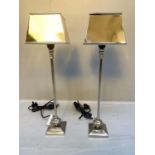 LIBRARY LAMPS, a pair, each measuring 64cm high, 18cm wide, polished metal finish, square form. (2)