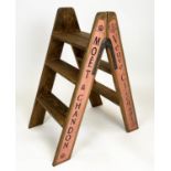 CHAMPAGNE STEPS, hinged A-frame four tread with champagne house insignias, 81cm H x 69cm x 44cm.