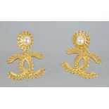 CHANEL CC LOGO EARRINGS, a pair, along with a pair of star and CC logo dangle earrings and a pair of