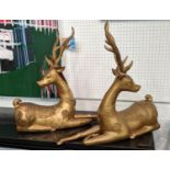 RECUMBANT DEER, pair, gilt metal, embossed decoration, 56cm H x 58cm L x 16cm D. (2)