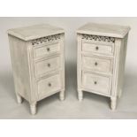 BEDSIDE CHESTS, a pair, French style traditionally grey painted with pierced frieze and three