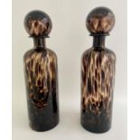 DECANTERS, pair, 40cm high, 10cm diameter, Murano style tortoiseshell glass. (2)