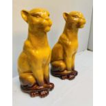 CERAMIC PANTHERS, a pair, 60cm high, 20cm wide, 27cm deep. (2)