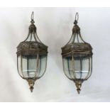 HANGING STORM LANTERNS, a pair, pierced metal and glazed, 73cm H. (2)