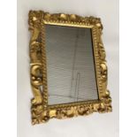 ITALIAN WALL MIRROR, 19th century Florentine carved giltwood with scrolling acanthus frame, 71cm H x