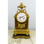 FRENCH 19TH CENTURY GILT MANTLE CLOCK, on shaped fitted wooden and gilt stand, 44cm H.
