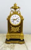 FRENCH 19TH CENTURY GILT MANTLE CLOCK, on shaped fitted wooden and gilt stand, 44cm H.